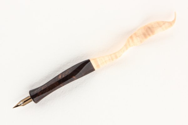 Hand carved ergonomic straight pen holder made of Stabilized Maple Burl and Curly Sycamore Maple.