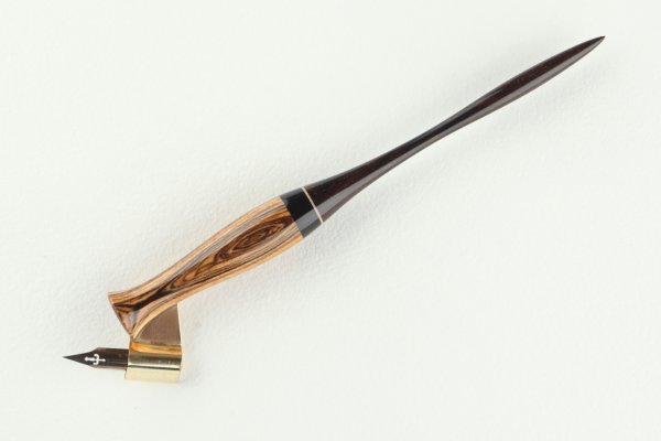 Oblique pen holder made of Bocote, Gabon Ebony and Brazilian Ebony wood, with a thin insert of Sycamore Maple wood.