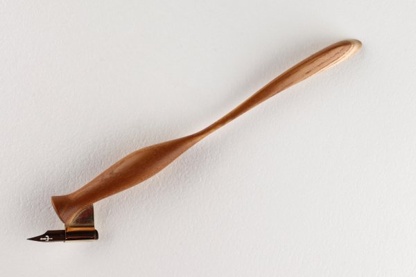 Oblique pen holder with hand carved tail, made of Mulberry wood.