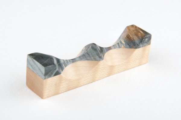 Pen rest made of stabilized Maple Burl and curly Sycamore Maple wood.